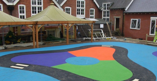 Installing Wetpour Floors in Wood End